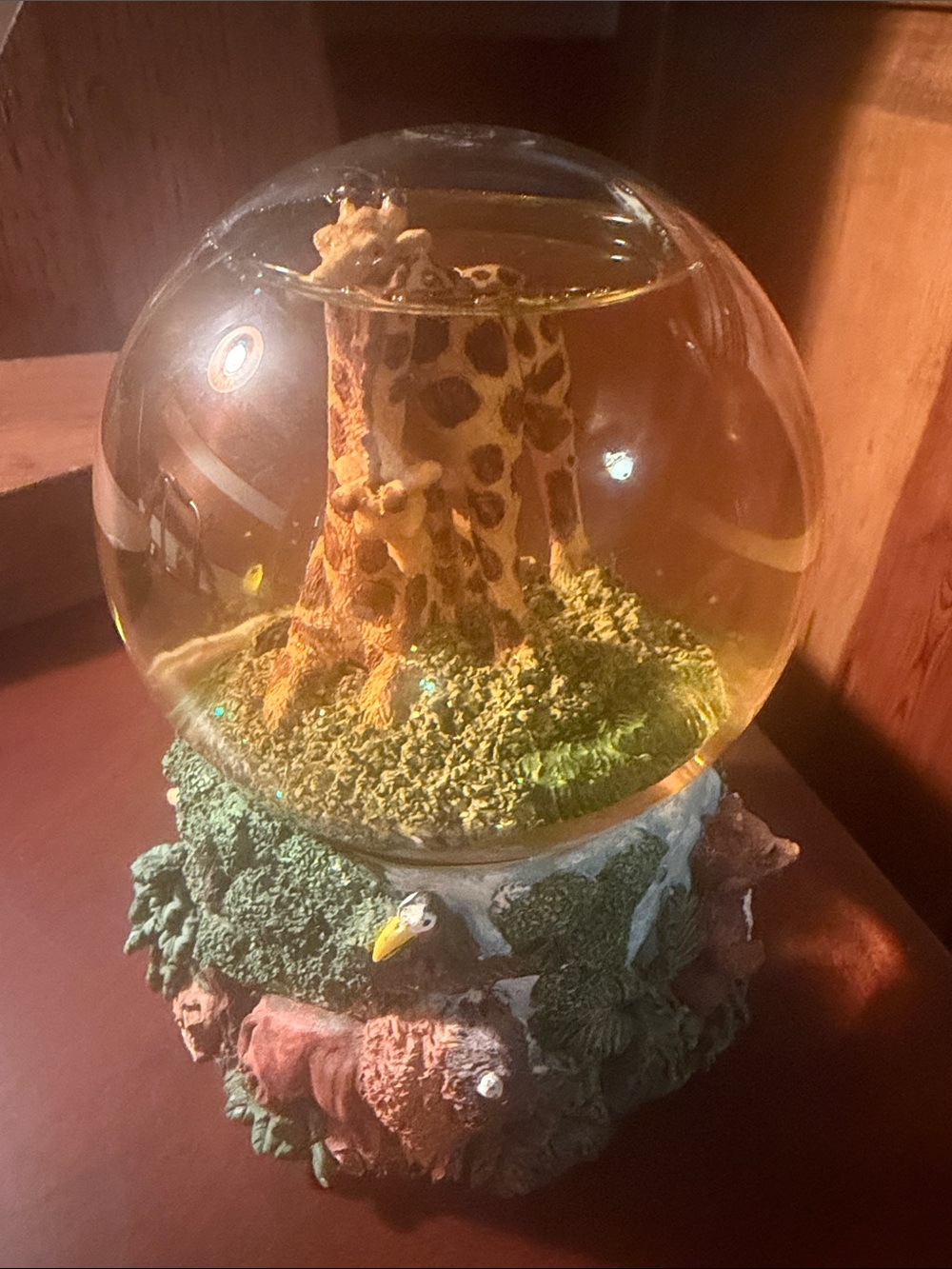Vintage Music Snow Globe featuring a pair of giraffes and other zoo animals